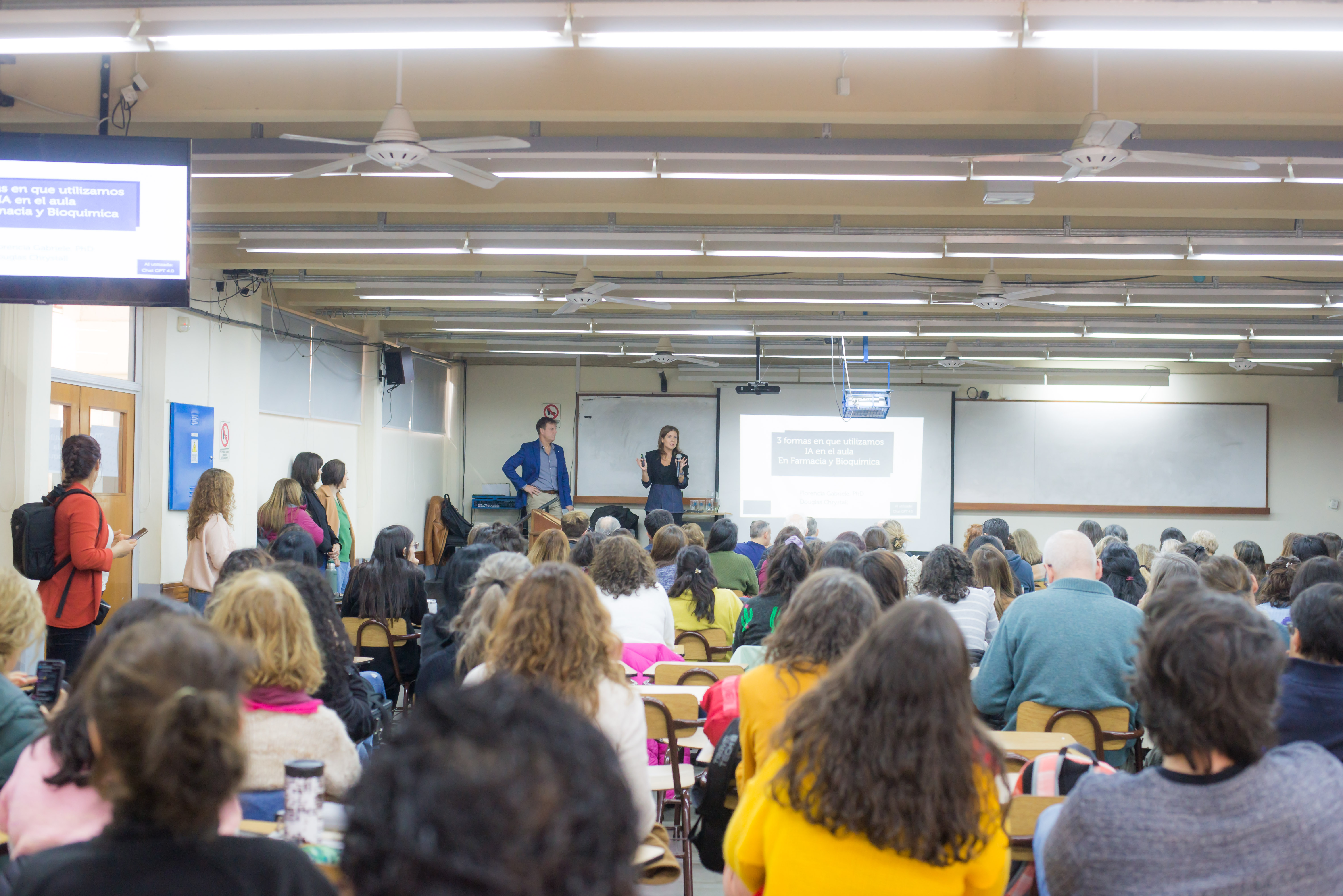 Dr. Florencia Gabriele teaching a packed lecture hall