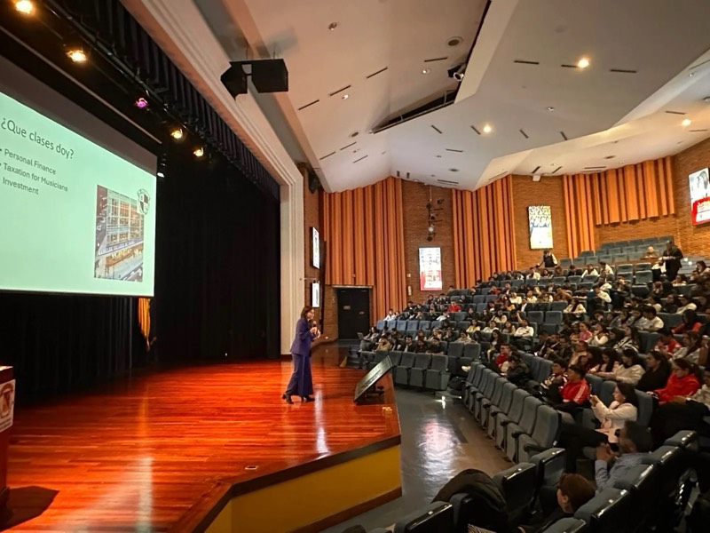 Dr. Gabriele presenting to a full auditorium in Colombia